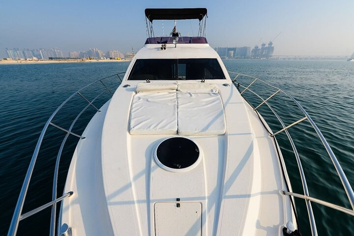 Sail through Dubai Marina aboard a luxury yacht soaking in stunning views of iconic landmarks while enjoying the soothing ocean breeze on your memorable cruise.
